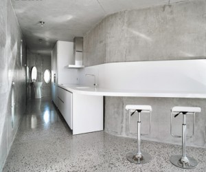 365235-_A_Corian_counter_and_backsplash_hug_the_kitchen_wall_Photograph_by_David_Frutos_Bis_Images_
